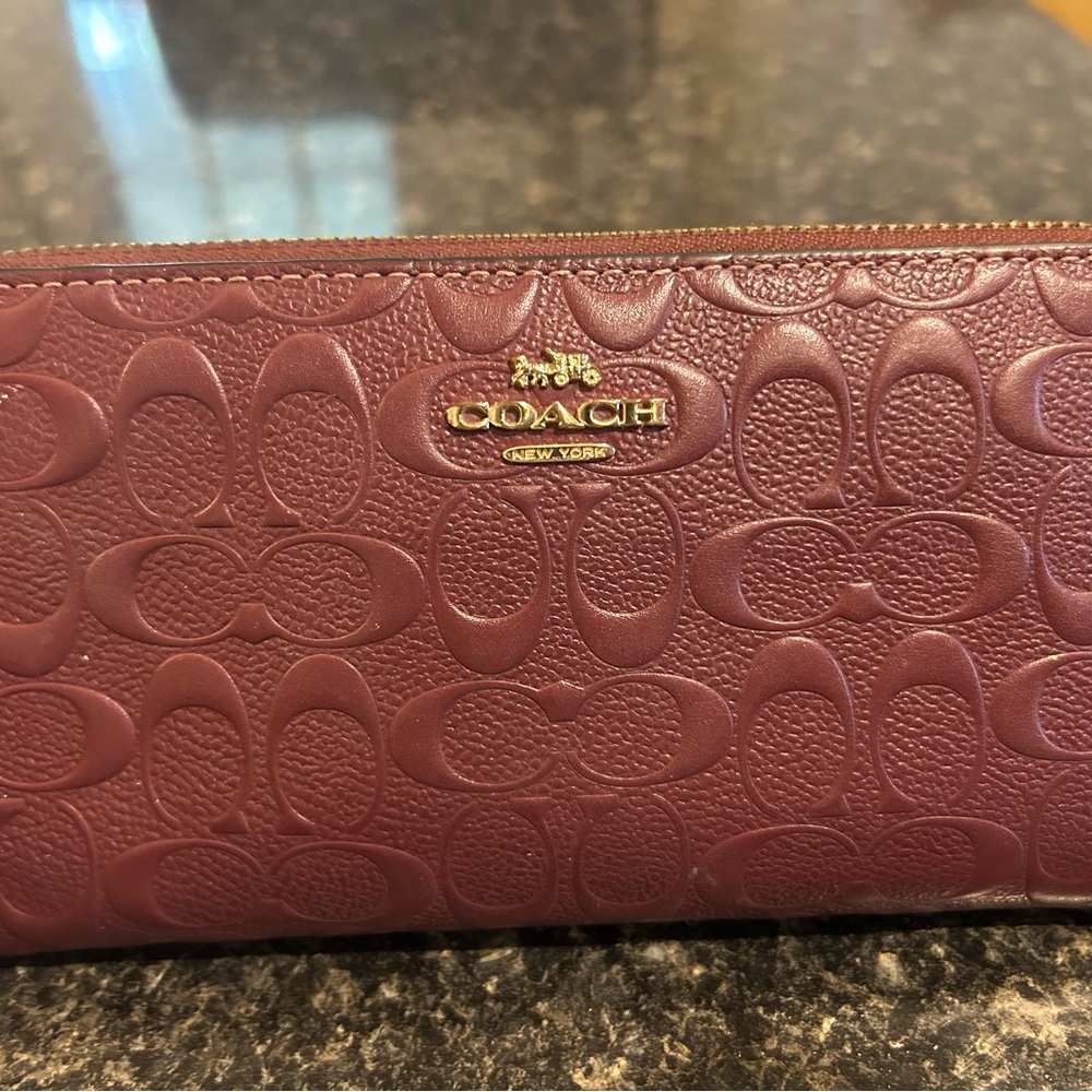 Coach Brown Wallet with Signature Embossed Design